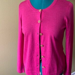 Elegant button down sweater with very beautiful dressy buttons.